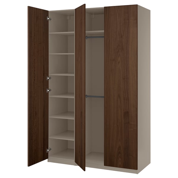 An open PAX wardrobe with dark brown wooden doors and shelves.