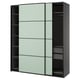 Modern gray PAX wardrobe with light-green mirrored sliding doors and internal shelves.