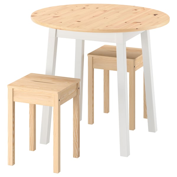 IKEA PINNTORP set: round table and stools. Table: white legs, wooden top. Stools: natural wood. Minimalist, elegant design.