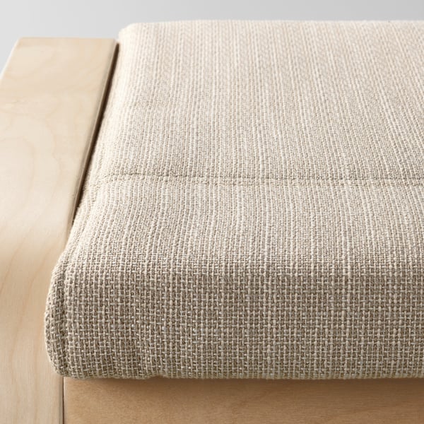 Close-up of a high-quality, beige cushion on a wooden frame, showcasing its texture and design.