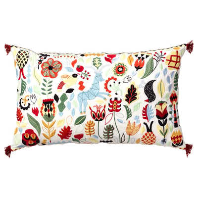 RÖDARV pillow: floral & geometric patterns in red, blue, green, yellow on white base with tassels.