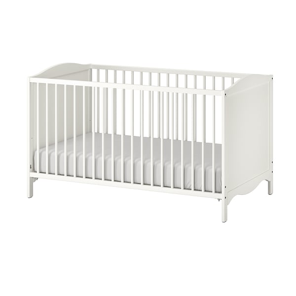 White wooden baby cot, rectangular and minimalist design, four raised legs, vertical slats on all sides for ventilation.
