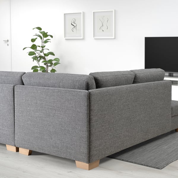Modern living room with SÖRVALLEN sofa, plant, tv, and artwork.