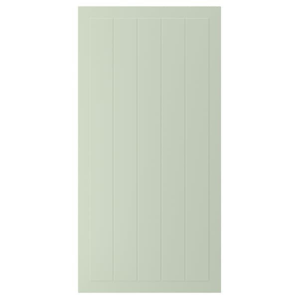 A green STENSUND cabinet door with vertical grooves, made from fiberboard and painted with polyurethane and acrylic finishes.