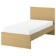 Minimalist light wood bed with white mattress, clean design, sturdy construction.