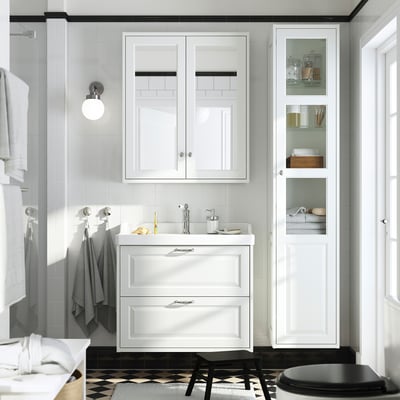 Modern bathroom with TÄNNFORSEN white vanity and large mirror cabinet, dark floor, narrow cabinet.