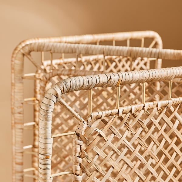 Handwoven rattan room divider with intricate lattice pattern, showcasing natural texture and craftsmanship.