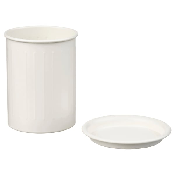 Two white kitchen items: tall round holder, small flat dish. Made of metal, simple design.