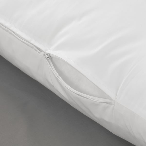 Close-up of white zippered pillow cover, showcasing quality fabric and detailed stitching.
