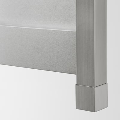 Close-up of sleek, stainless steel kitchen cabinet edge, showcasing smooth finish and quality craftsmanship.