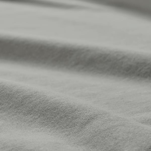 Closeup of soft, textured cotton jersey fabric, showcasing its smooth weave and quality.