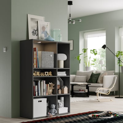 Grey VIHALS storage unit in living room with mixed storage and cable management.