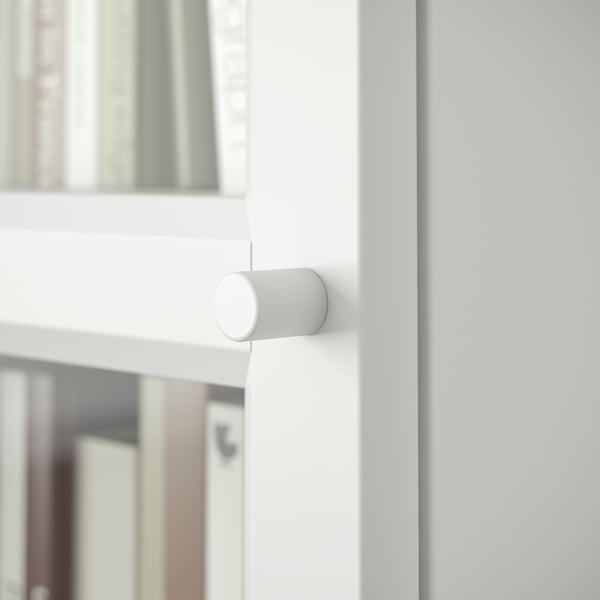 White BILLY bookcase with adjustable cylinder hinge.