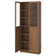 Walnut BILLY bookcase with glass doors, versatile storage.