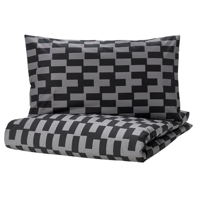 Black and grey pixelated bedding set with a duvet cover and pillowcase. Modern geometric pattern, soft cotton blend fabric.