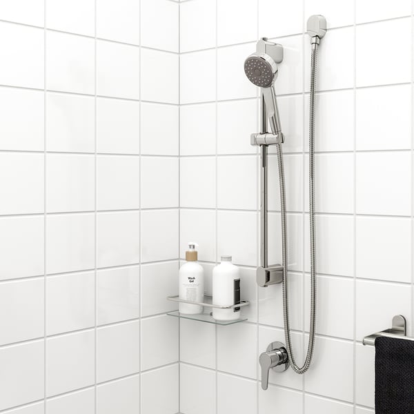 Chrome BROGRUND shower head & rail, stainless rail, handheld showerhead with hose, glass shelf with 2 bottles, black towel.