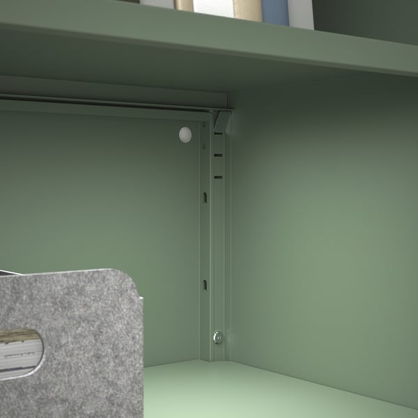 High-quality green metal cabinet with sturdy frame and adjustable shelf, designed for durability and moisture resistance.