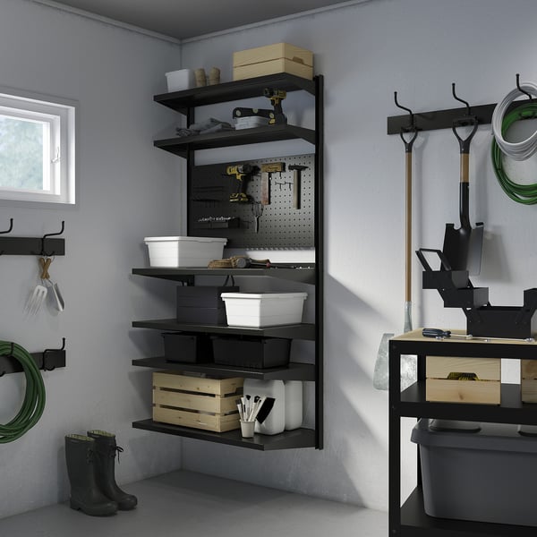 BROR storage unit with shelves, pegboard, containers, tools, and boots.