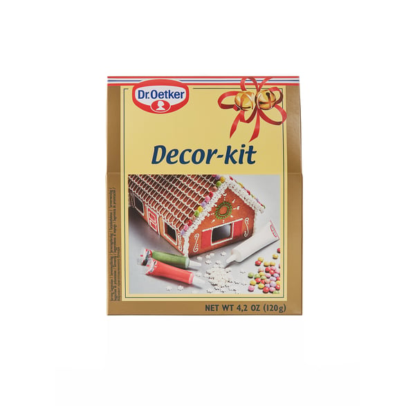 Dr. Oetker decorating kit box. Shows gingerbread house, icing tubes, candies. Used for baking.