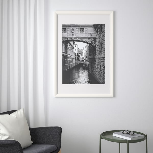 Framed black-and-white venetian bridge photo.
