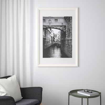 Framed black-and-white venetian bridge photo.