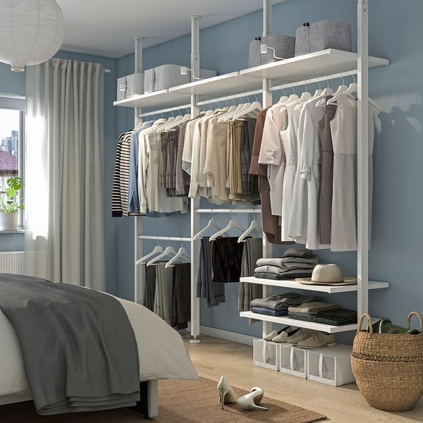 ELVARLI wardrobe in white with clothes & accessories, maximising space in a modern bedroom.