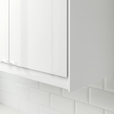White kitchen cable cover, seamless with tiles.