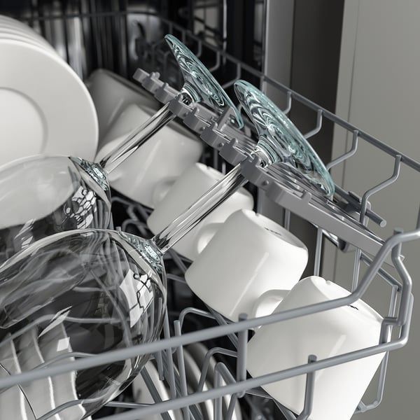 Dishwasher rack with glassware securely held, showing efficient design for cleaning.