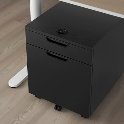 Black mobile filing cabinet with lock on wheels, fits under desks.