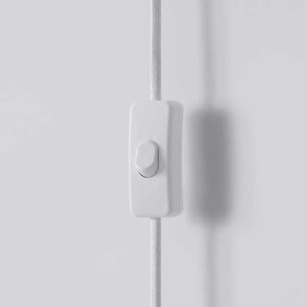 White cord switch with smooth, textured surface; sleek, modern design.
