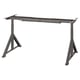 A black adjustable metal desk frame, IDÅSEN, with a sleek, modern design. It extendable legs for varying heights and tabletop sizes.