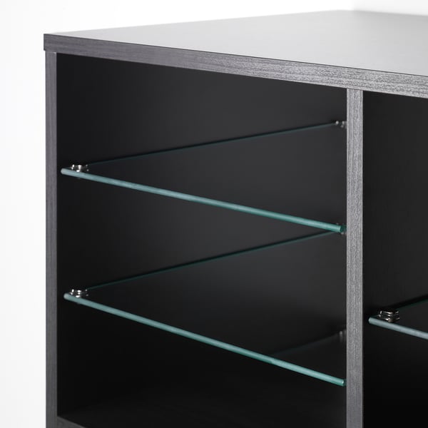 KALLAX glass shelf shown, designed for KALLAX shelving. Three glass levels for storage, securely held by metal supports.