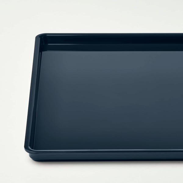 Dark blue rectangular plastic tray, smooth surface, clean and undamaged.