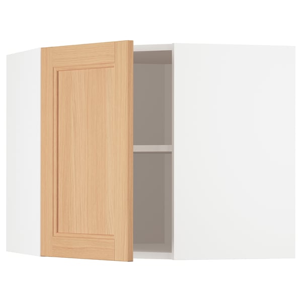 A white METOD kitchen cabinet with an open wooden door revealing an adjustable shelf inside.