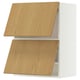 METOD white and wood cabinet with two slanted doors.