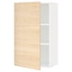 A white METOD kitchen cabinet with an ash wood patterned door. It one adjustable shelf and sturdy construction.