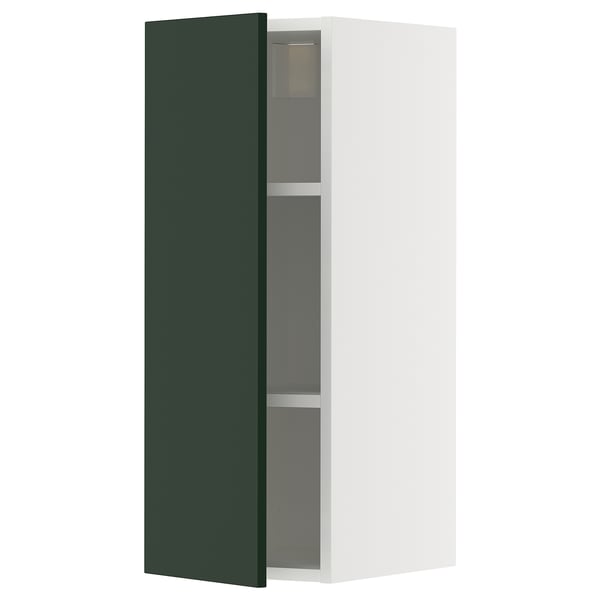Vertical white kitchen cabinet with dark green door and three shelves.