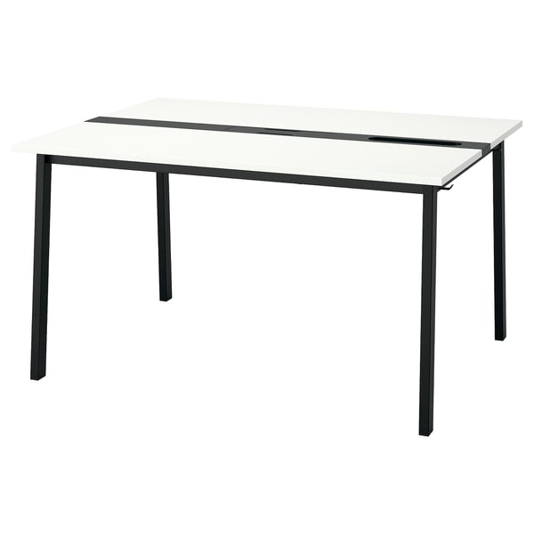 A modern, rectangular MITTZON conference table with a white top and black metal legs.