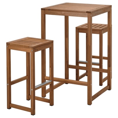 An outdoor furniture set named NÄMMARÖ in brown colour, made of acacia wood with a square table and two stools.