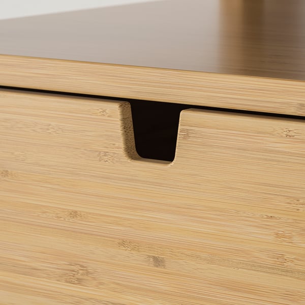 Close-up of bamboo drawer front with sleek handle, showcasing texture and quality.
