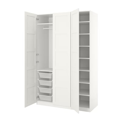 White PAX wardrobe, open revealing mesh baskets and shelves. Simple, modern design with white texture.