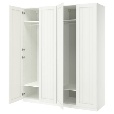 White ikea PAX wardrobe with open doors showing shelves.