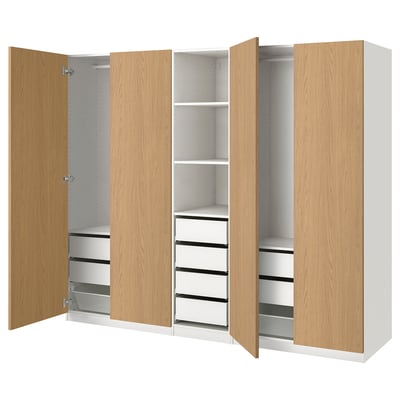 PAX wardrobe with oak finish, three sections, two with drawers, one open shelf.