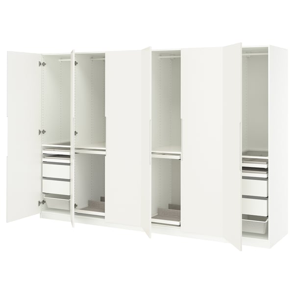 White PAX wardrobes: tall, sleek, with open doors revealing shelves and drawers for organised storage.