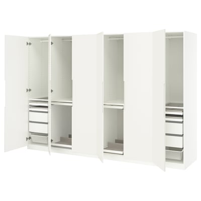 White PAX wardrobes: tall, sleek, with open doors revealing shelves and drawers for organised storage.