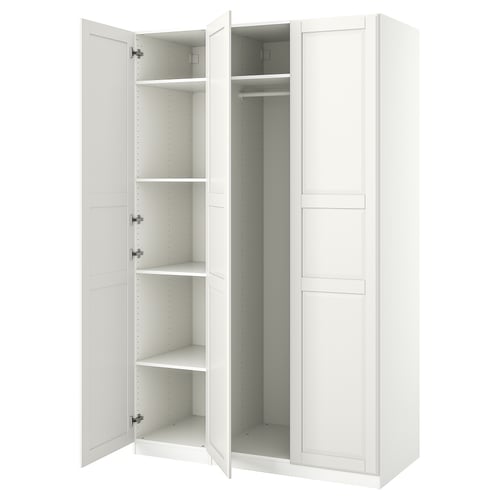 White ikea PAX wardrobe, open doors revealing shelves.