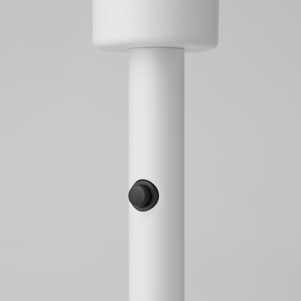 Minimalist lamp base, sleek white wood finish, single black control button.