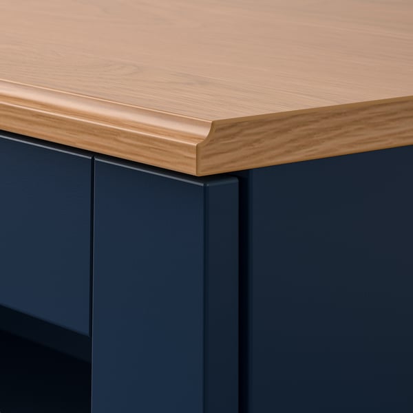 Wooden countertop with sleek edge on dark cabinet