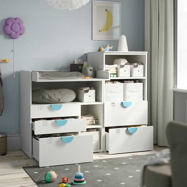 Modern nursery furniture with changing table, drawers, and shelves. Store diapers, clothes, and toys. Easy transformation for desk use.