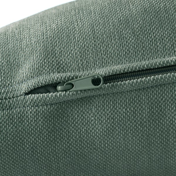 Close-up of zip on a high-quality, textured fabric, likely from a sofa, showcasing durability and easy-to-clean design.